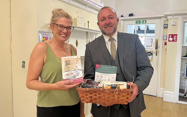 Hamper being given to raffle prize winner