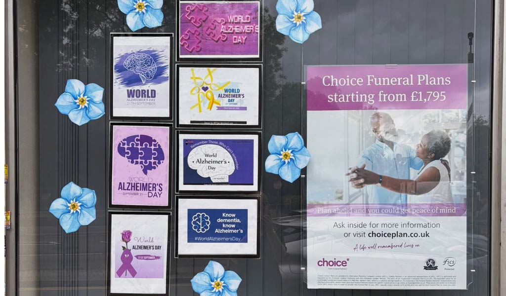 Doves Funeral Director's Alzheimer's Awareness window display.